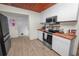 Bright kitchen featuring butcher block countertops and stainless steel appliances at 210 Wilder Rd, Lakeland, FL 33809