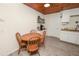 Cozy kitchen nook with wood table and white cabinets at 210 Wilder Rd, Lakeland, FL 33809