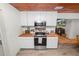 Updated kitchen with stainless steel appliances and wood countertop at 210 Wilder Rd, Lakeland, FL 33809