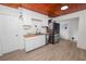 Modern kitchen with white cabinets and wood countertops at 210 Wilder Rd, Lakeland, FL 33809