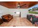 Living room with wood ceiling and leather couches at 210 Wilder Rd, Lakeland, FL 33809