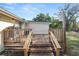 Wooden deck with steps and railing at 210 Wilder Rd, Lakeland, FL 33809