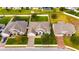 Aerial view of three homes with pools and large backyards at 332 Lake Mariana Way, Auburndale, FL 33823