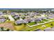 Aerial view of a home with pool and fenced backyard at 332 Lake Mariana Way, Auburndale, FL 33823