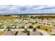 Aerial view showcasing a single-Gathering home's location in a residential neighborhood at 332 Lake Mariana Way, Auburndale, FL 33823