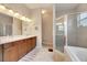 Spa-like bathroom with a walk-in shower and double sinks at 332 Lake Mariana Way, Auburndale, FL 33823