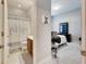Bathroom with shower and toilet, adjacent to bedroom at 332 Lake Mariana Way, Auburndale, FL 33823
