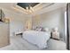 Spacious Primary bedroom with plush bedding and an en-suite bathroom at 332 Lake Mariana Way, Auburndale, FL 33823