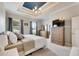 Comfortable Primary bedroom with a king-size bed and large windows at 332 Lake Mariana Way, Auburndale, FL 33823