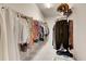 Large walk-in closet with ample shelving and hanging space at 332 Lake Mariana Way, Auburndale, FL 33823