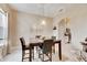Casual dining area with a marble top table and four chairs at 332 Lake Mariana Way, Auburndale, FL 33823