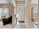 Bright and airy entryway with high ceilings and tile flooring at 332 Lake Mariana Way, Auburndale, FL 33823