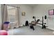 Home gym with weight bench, dumbbells and exercise mat at 332 Lake Mariana Way, Auburndale, FL 33823