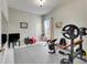 Home gym with weight bench, dumbbells, and exercise ball at 332 Lake Mariana Way, Auburndale, FL 33823