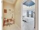 Home office features a workspace with a desk and chair, near a bedroom at 332 Lake Mariana Way, Auburndale, FL 33823