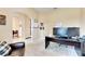 Spacious home office with desk, seating, and view to dining area at 332 Lake Mariana Way, Auburndale, FL 33823