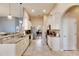 Modern kitchen with white cabinets, granite counters, and stainless steel appliances at 332 Lake Mariana Way, Auburndale, FL 33823
