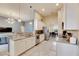 Open kitchen boasts granite counters, stainless steel appliances, and breakfast bar at 332 Lake Mariana Way, Auburndale, FL 33823