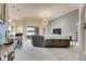 Living area featuring sectional sofa and access to backyard at 332 Lake Mariana Way, Auburndale, FL 33823