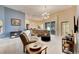 Spacious living room with sectional sofa and modern chandelier at 332 Lake Mariana Way, Auburndale, FL 33823