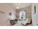 Home office with a desk, chaise lounge, and large window at 332 Lake Mariana Way, Auburndale, FL 33823