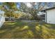 Large backyard with grassy area and pool at 4409 Hallam Hill Ln, Lakeland, FL 33813