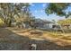 Large backyard with playset and screened pool at 4409 Hallam Hill Ln, Lakeland, FL 33813