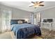Bedroom with backyard access and ensuite bathroom at 4409 Hallam Hill Ln, Lakeland, FL 33813