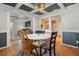 Dining room with a white round table, four chairs, and terracotta tile floors at 4409 Hallam Hill Ln, Lakeland, FL 33813