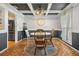 Dining room with a white round table, four chairs, and terracotta tile floors at 4409 Hallam Hill Ln, Lakeland, FL 33813