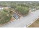 Aerial view showing a house and lot on a corner lot, with nearby roads and other houses at 515 S Charleston Ave, Fort Meade, FL 33841