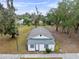 Aerial view of a house on a lot with trees at 515 S Charleston Ave, Fort Meade, FL 33841