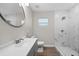 Updated bathroom with gray vanity and marble shower at 515 S Charleston Ave, Fort Meade, FL 33841