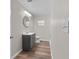 Updated bathroom with gray vanity and marble shower at 515 S Charleston Ave, Fort Meade, FL 33841