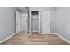 Spacious bedroom with wood-look floors and ample closet space at 515 S Charleston Ave, Fort Meade, FL 33841