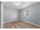 Spacious bedroom with wood-look floors and ample closet space at 515 S Charleston Ave, Fort Meade, FL 33841