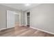 Spacious bedroom with wood-look floors and ample closet space at 515 S Charleston Ave, Fort Meade, FL 33841