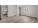 Bedroom with wood-look floors and a view of the kitchen at 515 S Charleston Ave, Fort Meade, FL 33841