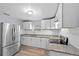 Modern kitchen with stainless steel appliances and granite countertops at 515 S Charleston Ave, Fort Meade, FL 33841