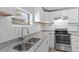 Modern kitchen with stainless steel appliances and granite countertops at 515 S Charleston Ave, Fort Meade, FL 33841