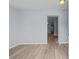 Bright and spacious living room with light grey walls and wood-look flooring at 515 S Charleston Ave, Fort Meade, FL 33841