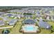Community pool and clubhouse with surrounding homes at 5460 Siltstone St, Lakeland, FL 33811
