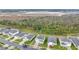 Aerial view of houses and a green landscape at 5460 Siltstone St, Lakeland, FL 33811