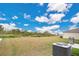 Large backyard with grassy area and AC unit at 5460 Siltstone St, Lakeland, FL 33811