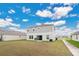 Two-story house with backyard, patio, and grill at 5460 Siltstone St, Lakeland, FL 33811