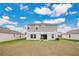 Two-story house with backyard, patio, and grill at 5460 Siltstone St, Lakeland, FL 33811