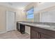 Double vanity bathroom with granite countertops and modern fixtures at 5460 Siltstone St, Lakeland, FL 33811