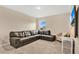 Spacious bonus room with sectional sofa and large TV at 5460 Siltstone St, Lakeland, FL 33811