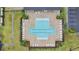 Community pool with lounge chairs and surrounding landscaping at 5460 Siltstone St, Lakeland, FL 33811