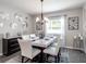 Bright dining room with modern chandelier and seating for six at 549 Silver Course Radl, Ocala, FL 34472